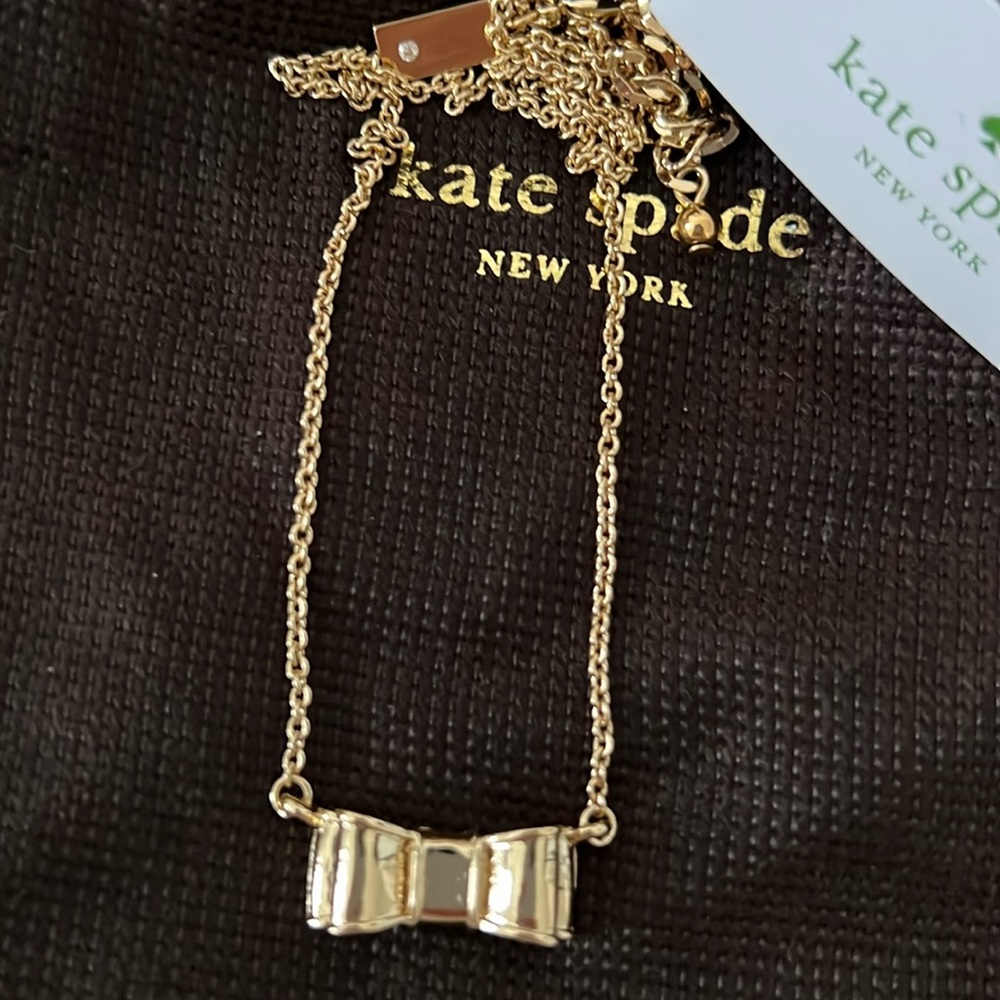 Brand new, never worn Kate Spade gold bow necklace